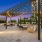 pergola with stringed lights over patio area on rooftop