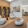 resident clubhouse seating area with couch, coffee table, cushioned chairs and bookshelves